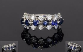 Sapphire And Diamond Dress Ring, Set With Two Rows Of 14 Round Modern Brilliant Cut Diamonds Between