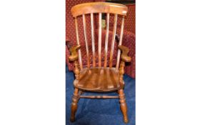 Windsor Style Chair High backed rustic style armchair in warm aged oak with turned legs and