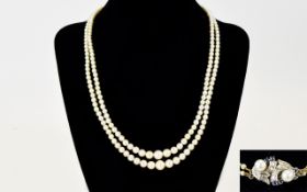 A Nice Quality Double Strand Cultured Pearl Necklace, with 18ct Gold Set Diamond and Sapphire Clasp,