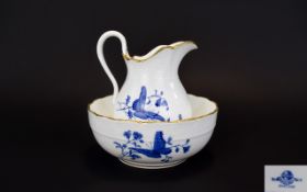 Mintons Ewer And Stand Small china jug and matching stand. White ground with cobalt blue floral