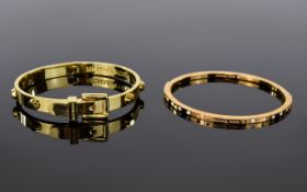 Two Michael Kors Bangles.