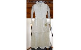 Vintage Wedding Dress An ivory wedding dress in the romantic revival style.