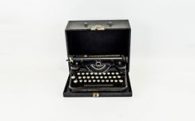 A Vintage Underwood Portable Typewriter Cased typewriter in traditional black lacquer finish with