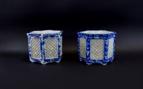 Pair of Late 19thC Chinese Blue and White Reticulated Planters 7 inches high 8 inches in diameter.
