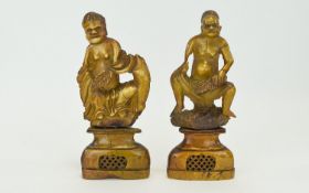 A Pair of 19th Century Soapstone Figures of Male Tribal Chiefs, Sitting and Holding Large Leaves