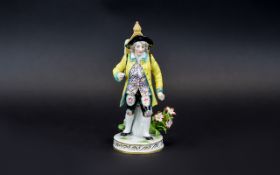 German Mid 19th Century Fine Quality Hand Painted Porcelain Figure of a Young Merchant In 18th