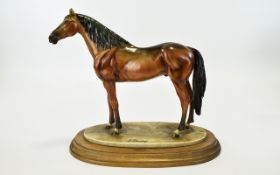 A Fine Signed Sculpture / Figure of a Stallion / Racehorse, Raised on an Oval Stepped Wooden Plinth,