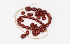A Single String of Cherry Natural Amber Bead Necklace. Requires Re-stringing. 31 grams.
