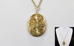 9ct Yellow Gold Large and Impressive Oval Shaped Hinged Locket with Chased Stylish Decoration to