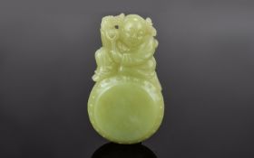 Antique Period Chinese Yellow Jade Boy and Drum Pendant, of Very Fine Quality and Proportions.