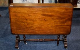 Sutherland Table Small rosewood drop leaf table with reticulated, carved leg detail.