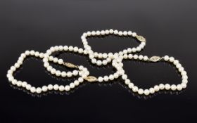 Four Row Cultured Pearl Necklace with 9ct gold clasp.
