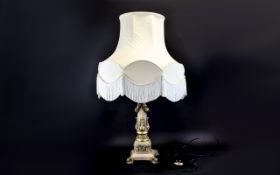 Standard Lamp On neoclassical gold tone column base with acanthus leaf trim and large cream shade.