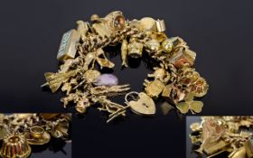 A Good Quality Antique 9ct Gold Curb Bracelet Loaded with Vintage 9ct Gold Quality Charms - Over (