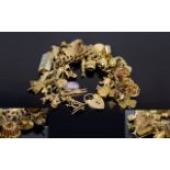 A Good Quality Antique 9ct Gold Curb Bracelet Loaded with Vintage 9ct Gold Quality Charms - Over (