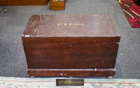 Antique Campaign Style Chest Large chest on plinth base with brass castors.