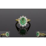 18ct Gold Emerald & Diamond Cluster Ring. The Oval Emerald Surrounded by 13 Diamonds. The Emerald of