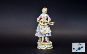 German 19th Century Hand Painted Porcelain Figurine - Features a Young Female Musician Playing a