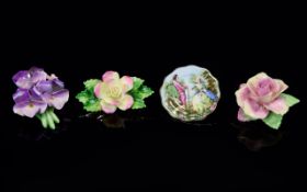 A Collection Of Ceramic Floral Posy Brooches Four in total to include Bairstow China tea rose,