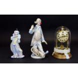 A Pair Of Ceramic Clown Figures Two in t