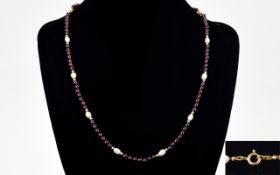 A Nice Quality Ruby and Pearl Set Necklace, Fitted with 9ct Gold Spacers and Clasp. Marked 9ct.