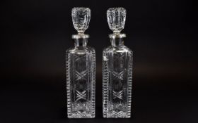 A Fine Pair of European 19th Century Silver Collared Cut Glass Decanters of Elegant Form.