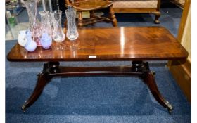 Mahogany Coffee Table of rectangular form, fluted legs with brass casters.