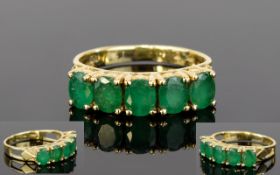 Ladies 14ct Gold Channel Set Emerald Ring. The Five Emeralds of Good Colour. Marked 14ct - 585.