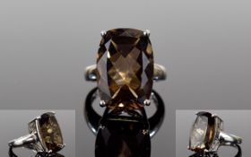 Smoky Quartz And Silver Statement Ring Set with large faceted emerald cut smoky topaz of approx