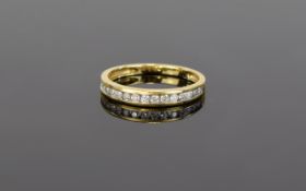 18ct Diamond Eternity Ring Of plain form set with multiple diamond chips