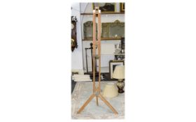 Artist's Studio Easel Fashioned in light pine, approx 60 inches in length.