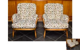 A Pair of Mid Century Blonde Wood Ercol Armchairs, recently re upholstered in heavy weight cream,