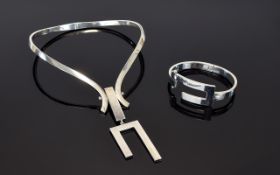 A Vintage Mexican Silver Statement Torque Necklace And Matching Bracelet Stylish modernist torque