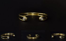 A Solid 9ct Yellow Gold Diamond Set Bangle From The 1960's / 1970's. The Bangle Ends Each Pave Set
