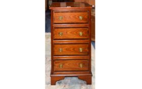 Modern Mahogany Chest Of 4 Drawers of small proportions. Raised on bracket feet.