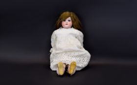 A Late 19th/Early 20th Century Bisque Doll Features Bisque head, legs and arms.