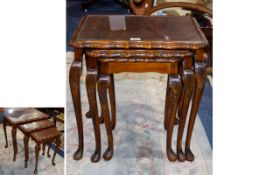 Nest Of 3 Mahogany Tables with glass top.