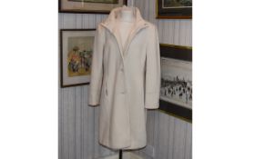 Cream Wool Blend Ladies Mid Length Coat By BHS features stand collar, concealed side seam pockets,