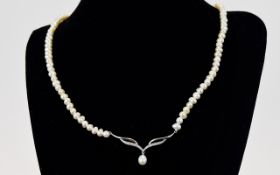 White Gold Diamond Set Cultured Pearl Necklace Attractive collar style necklace comprising multiple