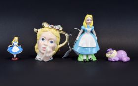 Alice In Wonderland Memorabilia. Comprises Ceramic Cheshire Cat, Ceramic Alice Figure, Small Alice