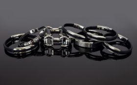 6 Designer Bracelets A collection of chunky statement bracelets in heavy silver tone links and
