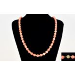 A Top Quality and Impressive 18ct Gold and Coral Beads Necklace with 18ct Gold Clasp and Spacers.