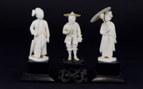 Three Japanese Ivory Figures standing on three black plinths. Circa 1910. 6 inches in height.
