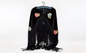 A Vintage Embroidered Velvet Shawl Small shoulder wrap in black velvet with long black fringing