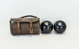 Vintage Bowling Balls Housed in original brown leather cylindrical case with double buckle