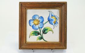 Early 20th Century Framed Ceramic Tile Earthenware tile with naive hand painted floral design in