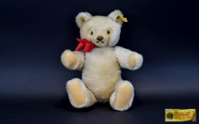 Steiff Bear Jointed blonde mohair bear by Steiff, complete with red ribbon to neck and traditional