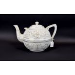 Large Cream Coloured Teapot with floral design and gold coloured marking.