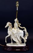 Capodimonte Lamp In the form of a maiden riding a horse, raised on a varnished wood base.