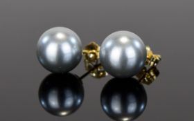 18ct Cultured Pearl Stud Earrings Elegant dove grey pearl studs with 18ct setting.